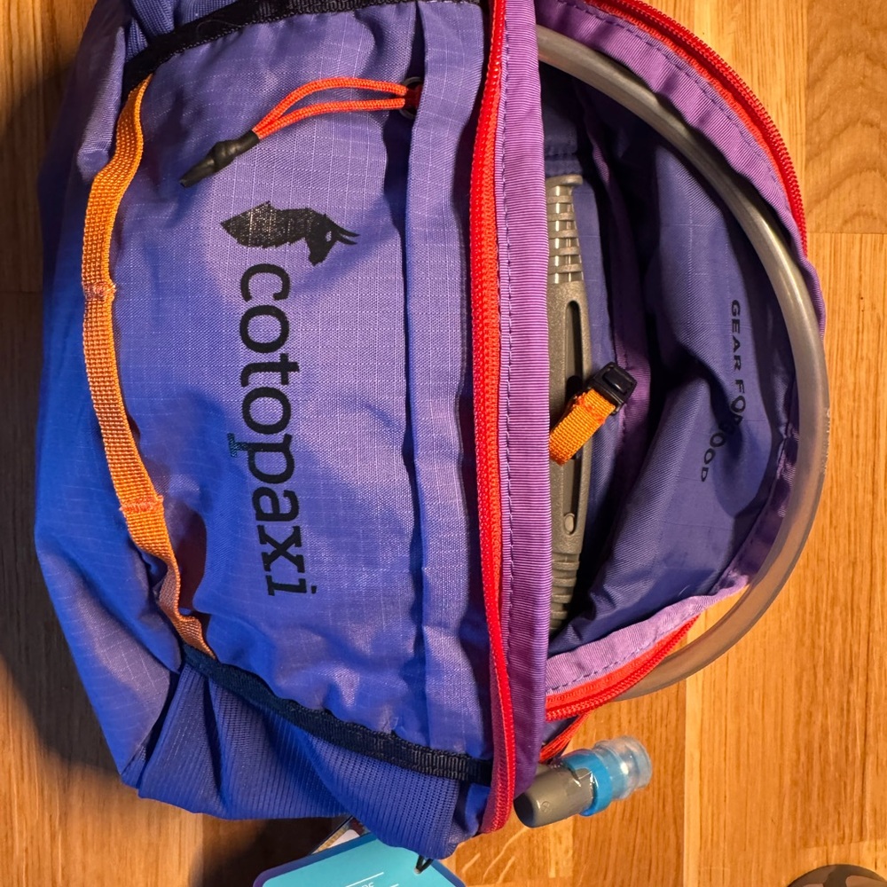 Cotopaxi Hydration Pack with Blue and Red Accents *never used*